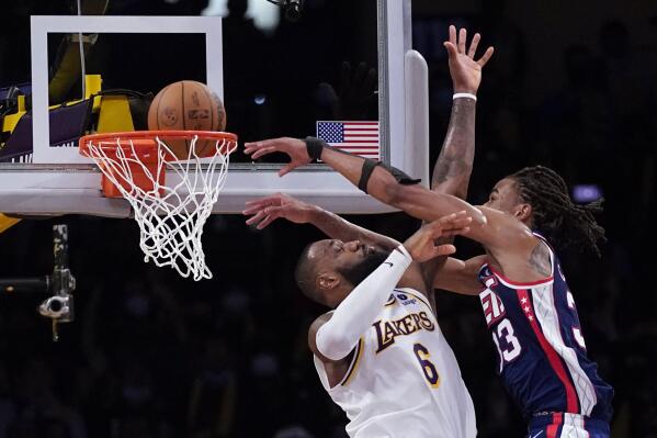Claxton oops over James late Nets hold off Lakers 122 115 AP News